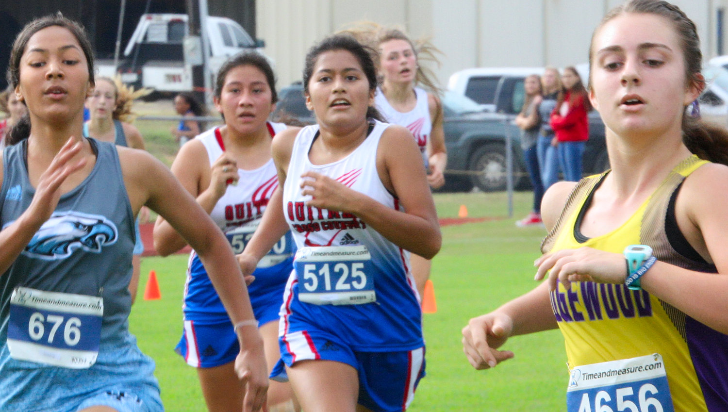 Alexa Flores eyes the finish line followed closely by teammate Joanna Santiago.